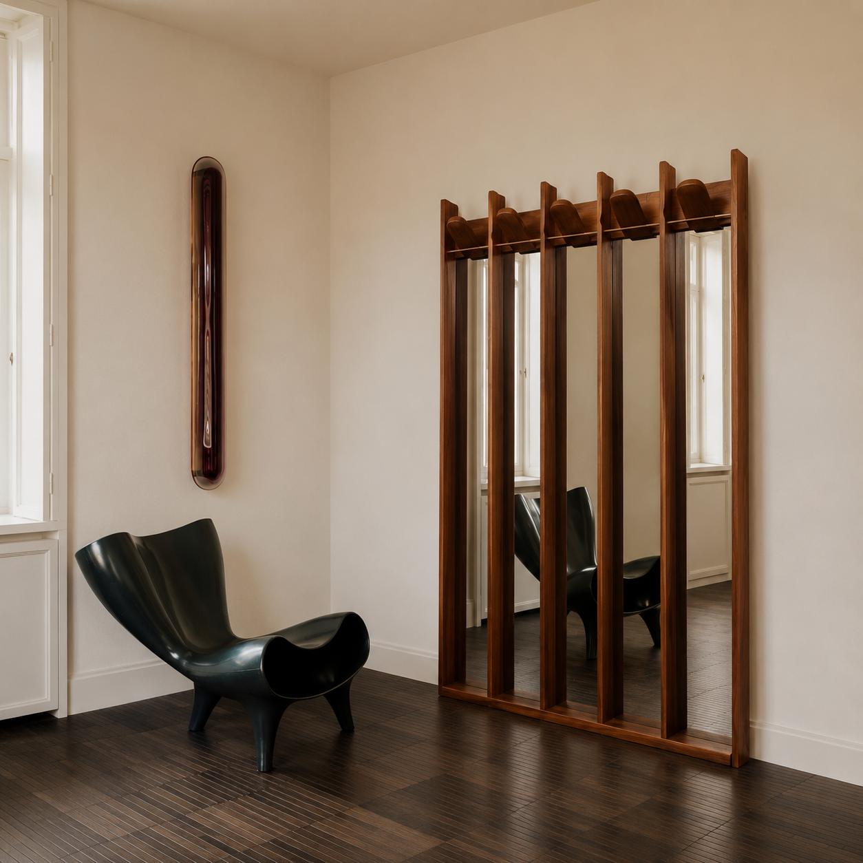 Wooden mirror with vertical slats in a room with a black chair and white walls.
