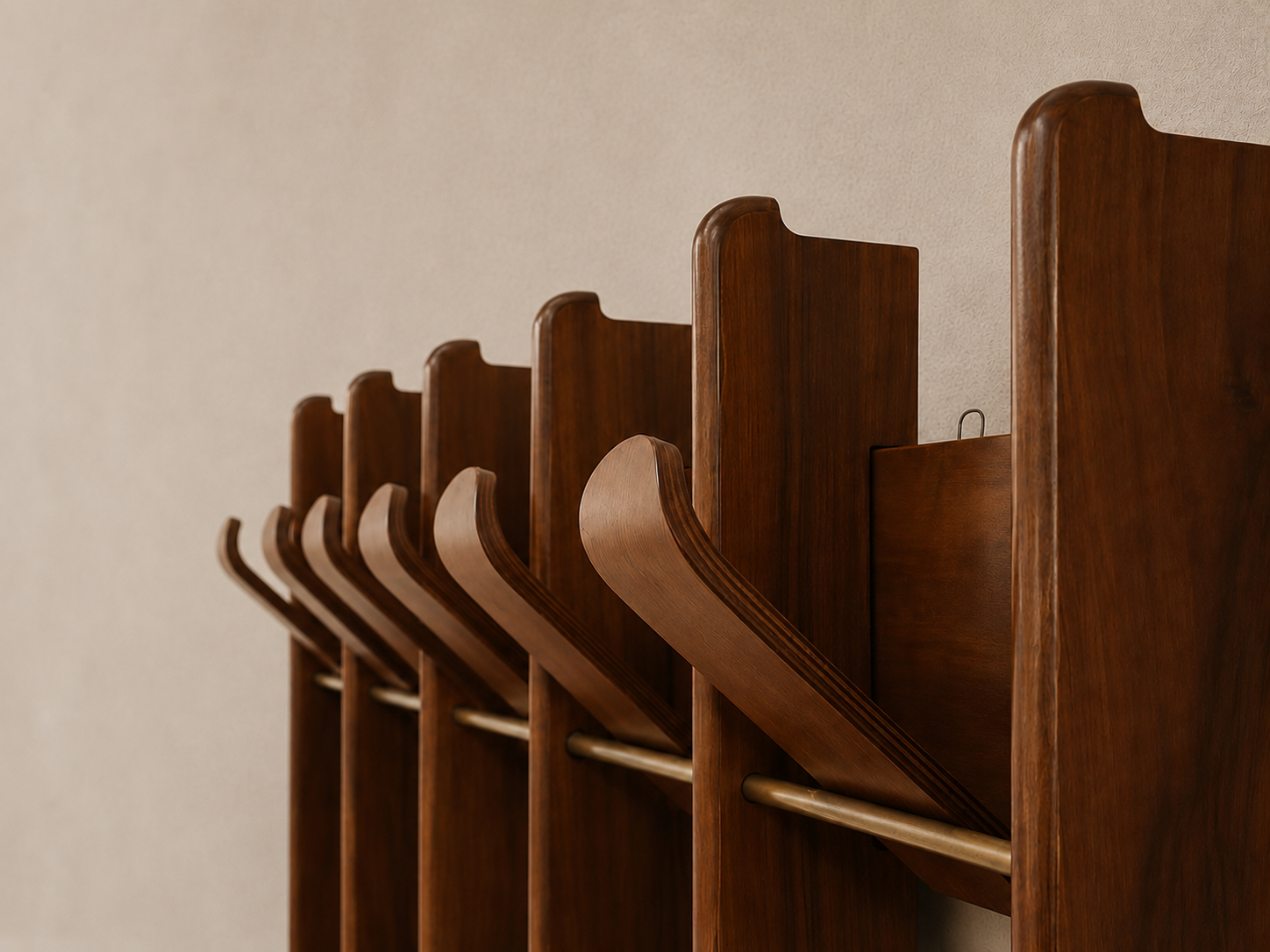 Row of wooden chairs against a beige wall